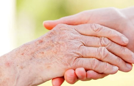 holding hands grieving over the loss of a loved one from a violent crime scene